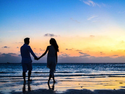 Couple holding hands on a romantic holiday destination